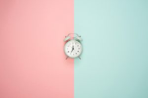 Alarm clock with pink and mint geometric background